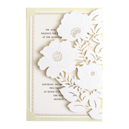 A wedding invitation with white flowers and a yellow background.