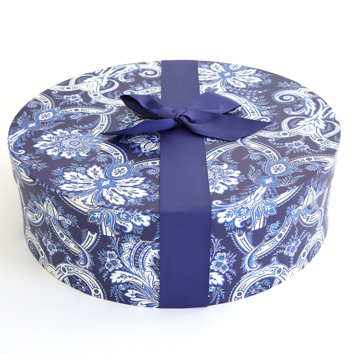A blue paisley Canton Bleu Hat Box Storage with a ribbon, designed by Anna Griffin.