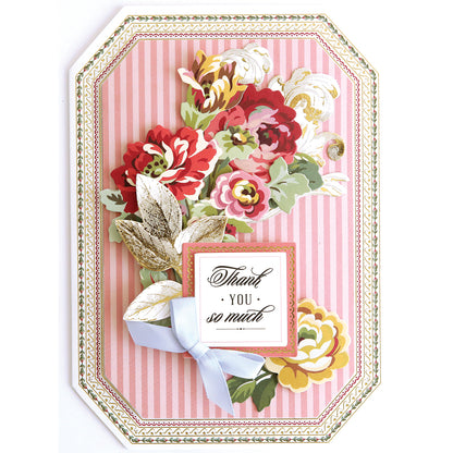 Simply Thank You Card Making Kits handmade card featuring pink vertical stripes, a floral bouquet, a light blue ribbon, and a square “Thank YOU so much” tag.