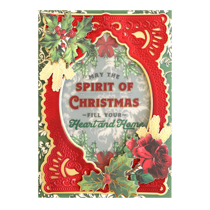 A festive Christmas card with a red and gold ornamental design, holly, and the message "May the spirit of Christmas fill your heart and home" in the center, enhanced with high quality Christmas Greetings Rub On Transfers for that extra touch of elegance.