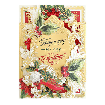 Intricately designed Christmas card with gold detailing, holly, red berries, white roses, and the message "Have a very Merry Christmas" in the center. Perfect for adding Christmas Greetings Rub On Transfers to elevate your holiday card decorations.