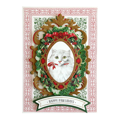 A festive greeting card features a white cat with a red bow, surrounded by a green, red, and gold ornate frame with the text "HAPPY PAWLIDAYS" below. Perfect for Christmas Kitties Stickers, this design brings paw-some sentiments to your holiday greetings.