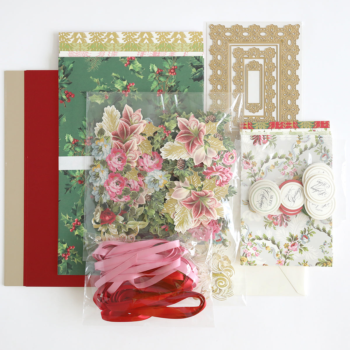 Eyelet Elegance Dies and Materials, featuring vibrant cardstock, floral cutouts, satin ribbons, and ornate sticker sheets, are artfully arranged on a flat surface.