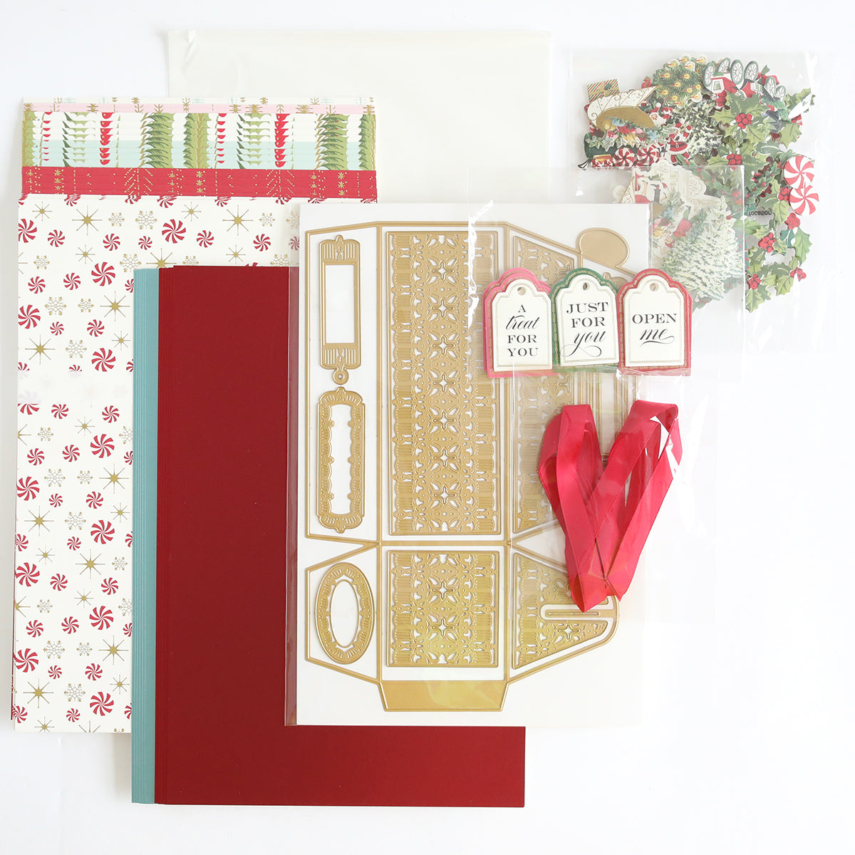 Introducing the Treat Boxes Dies and Materials: a curated assortment of crafting materials including patterned paper, 3D embellishments, ribbon, and festive die-cut shapes. Meticulously organized for making stunning treat boxes or boosting your creativity with vibrant cardstock.