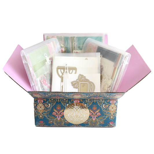 The Anna Griffin | Create 2025 Event Kit is a decorative floral box filled with envelopes, cards, and metal cutting dies in clear sleeves—perfectly organized for your next live streamed crafting session.