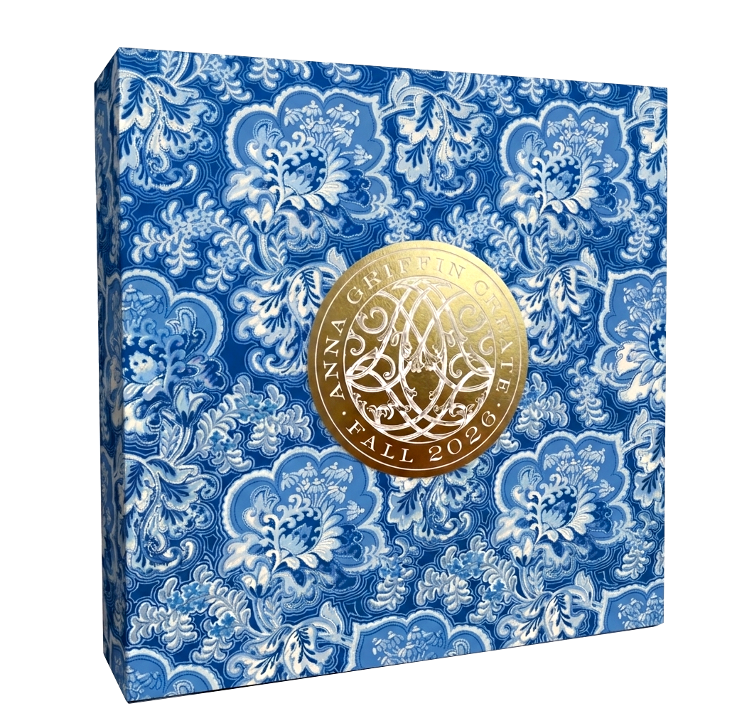 A blue and white floral box with a gold seal reading "Anna Griffin | Create Fall 2026"—perfect for adding heritage style to your home or storing craft class supplies.