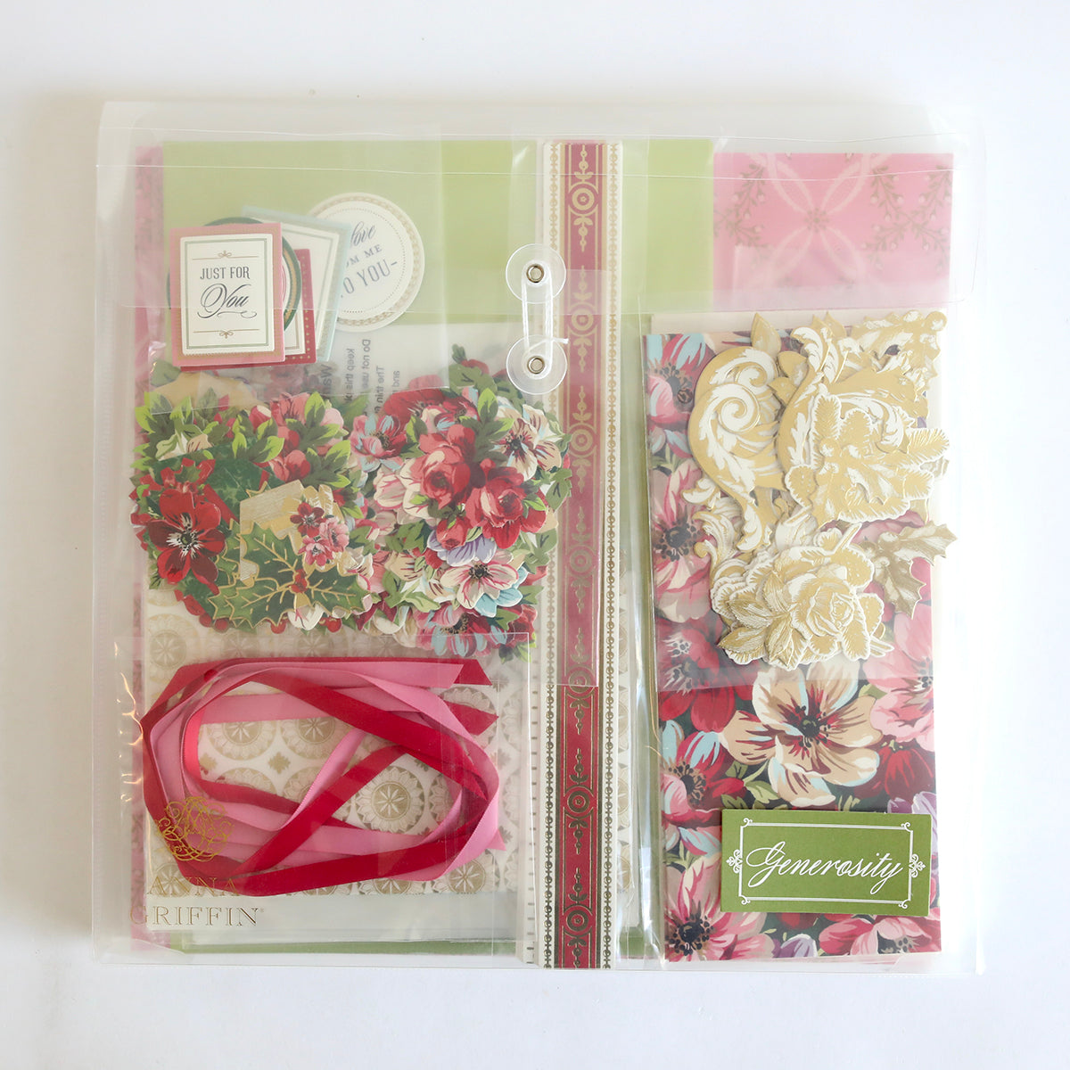 The Anna Griffin | Create 2025 kit includes a clear folder with floral paper, gold accents, pink ribbon, and "Generosity" labels—perfect for papercrafting events or experimenting with new crafting techniques.
