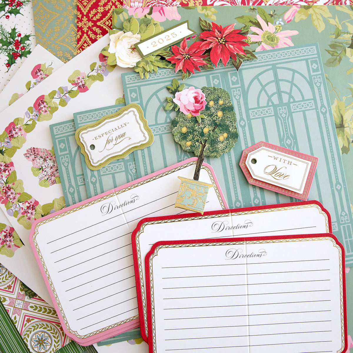 Anna Griffin | Create 2025 offers assorted decorative stationery for papercrafting, including "Directions" cards, floral paper, tags with "For you" and "With Love," plus a card labeled "2023.