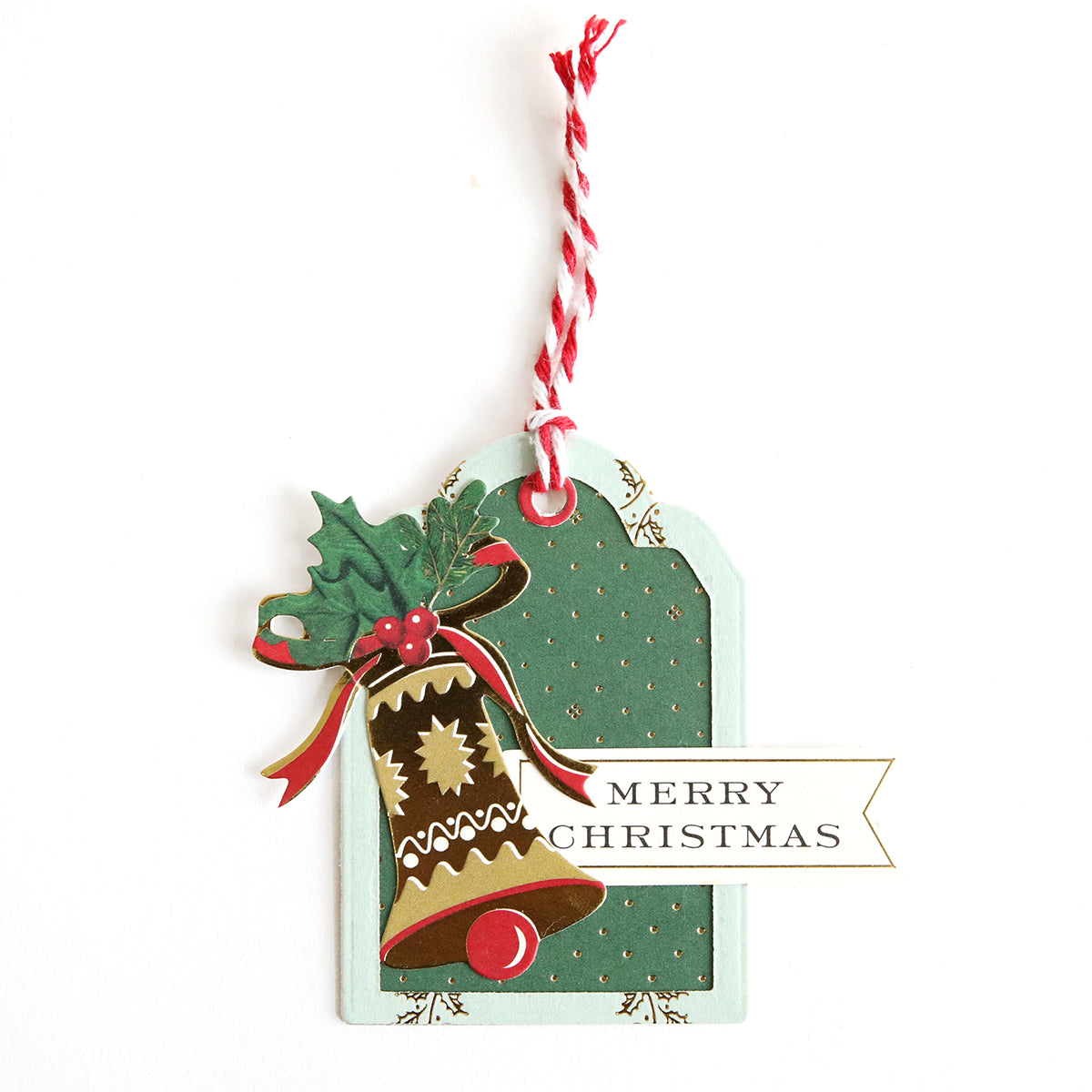 The Creative Tag Dies create festive tags with a decorated bell, holly leaves, and "Merry Christmas" label—ideal for handmade tags or adding a special touch to your Advent Calendar gifts.