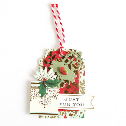 The Creative Tag Dies feature a festive design with red and white string, holly, and a "JUST FOR YOU" label—ideal for Advent Calendar surprises or as charming handmade tags on a white background.