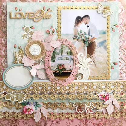 A decorative scrapbook page featuring a photo of a couple kissing, a vintage car, floral embellishments, gold lace, and the word "LOVE" in large letters at the top. The 3D Ribbon Border 12" Dies adds depth, while cut and emboss dies enhance the intricate details beautifully.