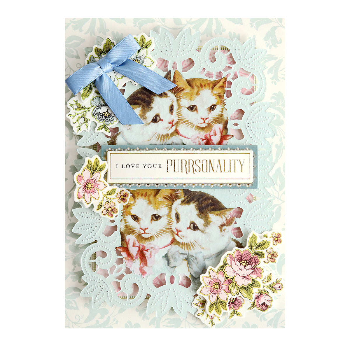 Charming greeting card for pet lovers featuring two cats with floral designs and a blue ribbon on an antique-inspired lacy blue background, reading "I love your purrsonality." Product: Cute Pet Rub On Transfers.