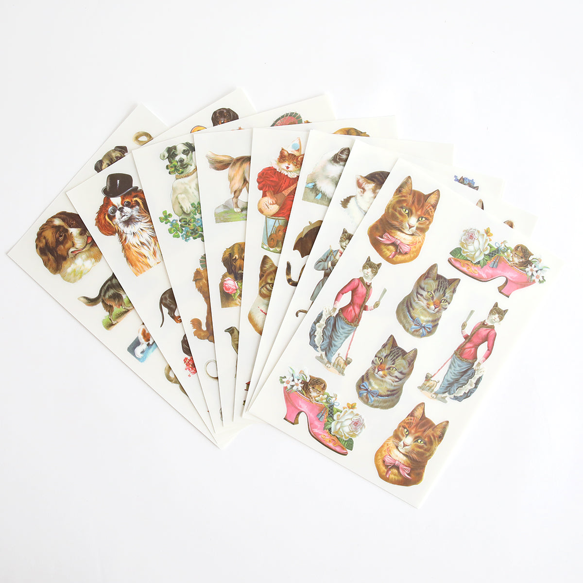 Five sheets of Cute Pet Rub On Transfers with antique-style illustrations of dressed animals and flower-adorned shoes, ideal for pet lovers.