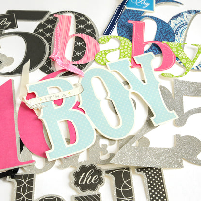 Add a festive touch to your handmade cards or scrapbook pages with the Friends and Family Diecut Word Assortment—this collection features assorted cutout letters and words in various colors and patterns, including "baby" and "IT'S A BOY," plus pink and blue accents, ribbons, and oversized diecut numbers.