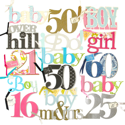 A collection from the Friends and Family Diecut Word Assortment featuring colorful, oversized cutout words and numbers—including "baby," "boy," "girl," "50," "25," "100," "16," and "over the hill"—set against a white background, perfect for adding a playful touch to handmade cards or scrapbook pages.