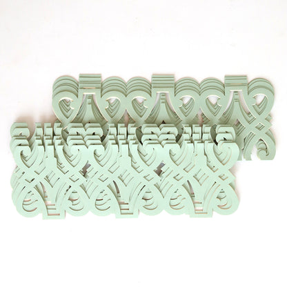 The Blue Grey Filigree Diecut Wrap 10 pack features a symmetrical design of interlocking, pale green decorative cut-outs on white, reminiscent of classic diecut wraps popular for elegant wedding invitations.