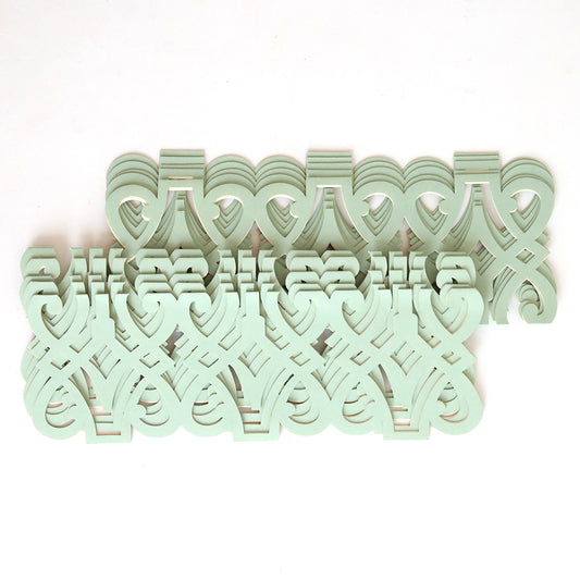 The Blue Grey Filigree Diecut Wrap 10 pack features a symmetrical design of interlocking, pale green decorative cut-outs on white, reminiscent of classic diecut wraps popular for elegant wedding invitations.