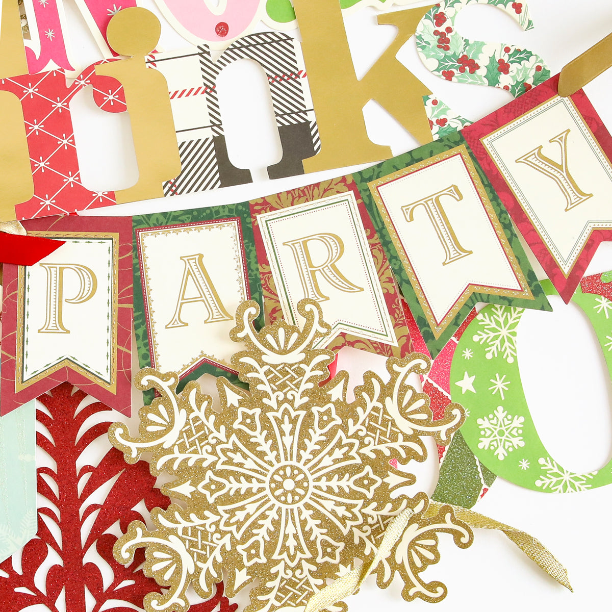 The Christmas Extreme Diecut Assortment features a gold snowflake and a festive "PARTY" banner surrounded by vibrant holiday-themed decorations in red, green, and gold—ideal for embellishing Christmas Cards or adding cheerful accents to your Scrapbook Pages.