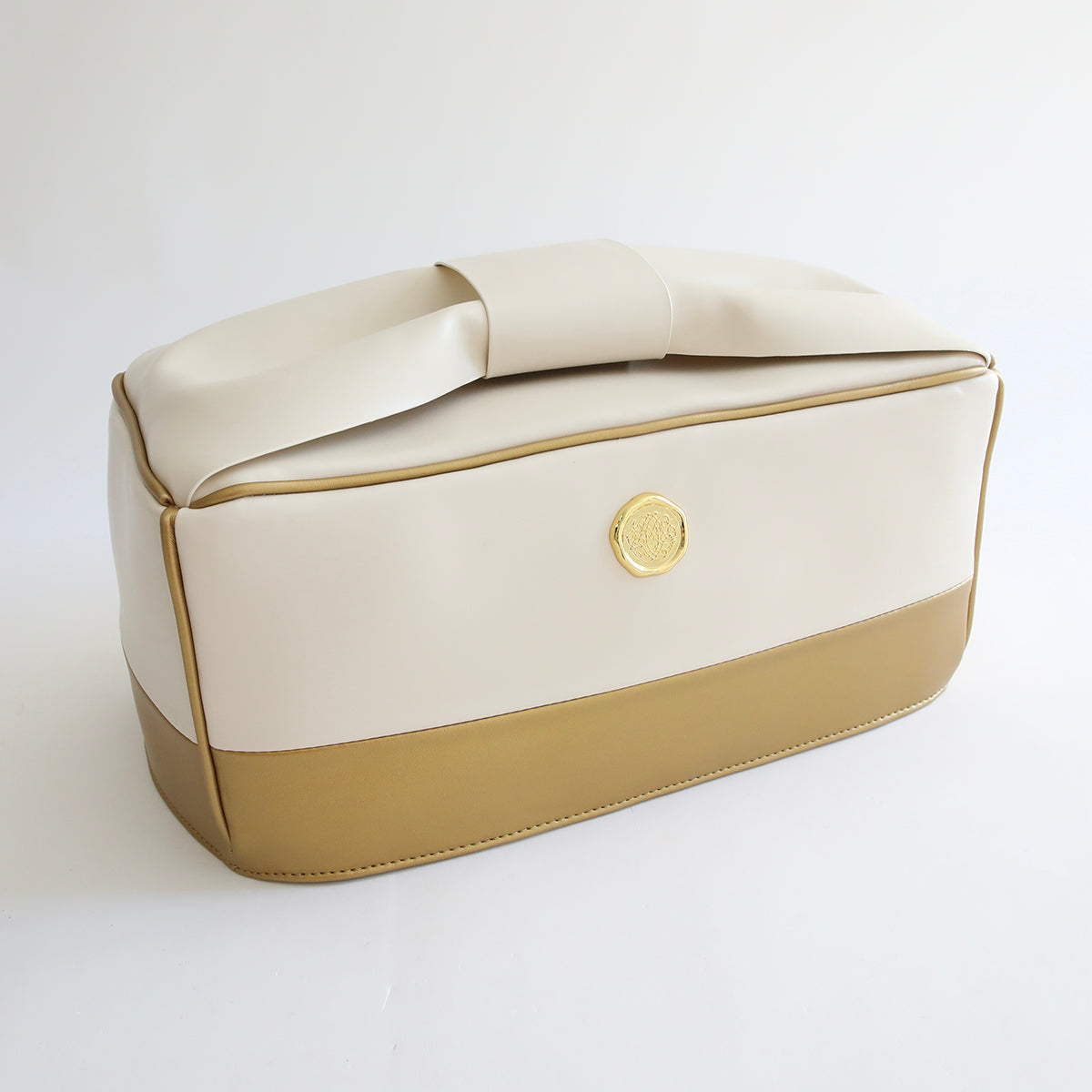 An Empress Tote and Dust Cover with a dust cover on a white surface.