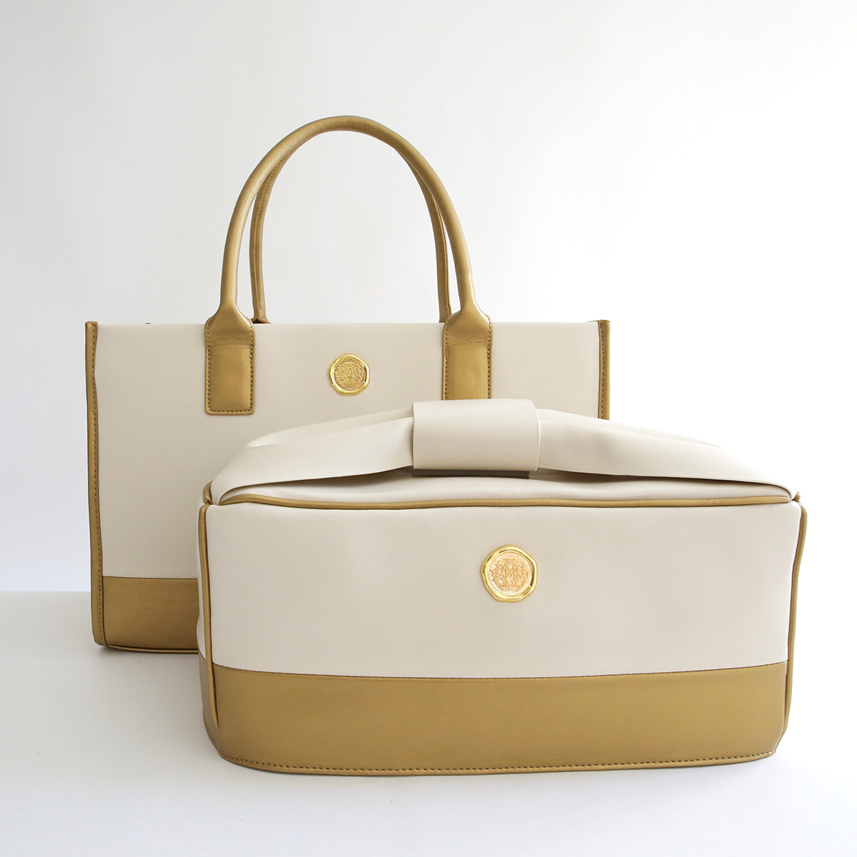 Two Empress Tote bags on a white surface.