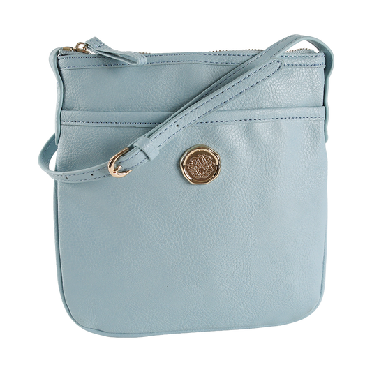 Beach Glass Blue Crossbody Bag made of light blue faux leather with a gold emblem and zipper closure, featuring an adjustable strap, displayed on a plain white background.