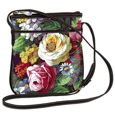 A hands-free Astrid Crossbody bag adorned with beautiful flowers, offering a stylish alternative to traditional purses.