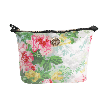 Introducing the Virginia Large Cosmetic Bag—a stylish zippered pouch adorned with pink, yellow, and green floral designs on a white background and accented with a gold emblem on the front. Perfect to use as a chic travel organizer or spacious makeup bag.