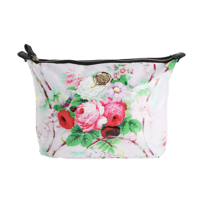 The Lillian Large Cosmetic Bag is a spacious makeup bag with a zippered pouch design, featuring a pink floral print, stylish black zipper tabs, and a circular gold emblem on the front—making it the perfect cosmetic bag or travel organizer for all your essentials.