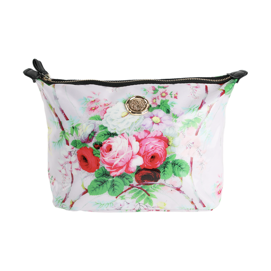 The Lillian Large Cosmetic Bag is a spacious makeup bag with a zippered pouch design, featuring a pink floral print, stylish black zipper tabs, and a circular gold emblem on the front—making it the perfect cosmetic bag or travel organizer for all your essentials.