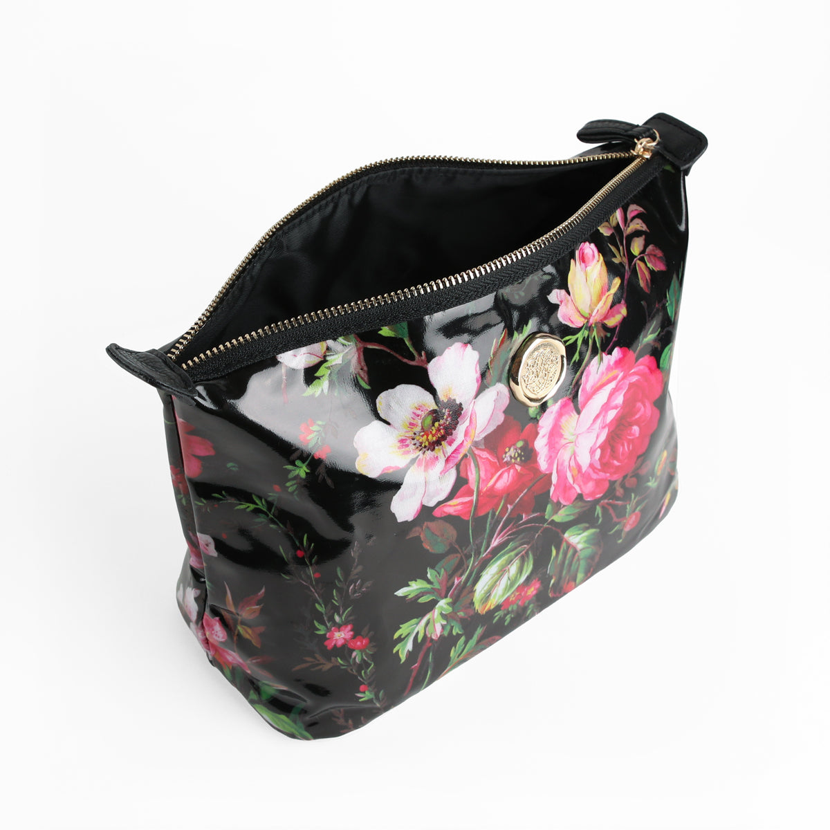 The Noire Large Cosmetic Bag, featuring a glossy black finish with a vibrant floral print and a gold emblem, is photographed against a white background and serves as a chic and spacious organizer for all your travel or makeup essentials.