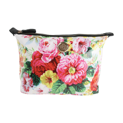 Annalise Large Cosmetic Bag—a rectangular zippered makeup bag with a colorful floral print of large pink, red, and yellow flowers, and a round gold emblem on the front—perfect as a travel organizer or spacious cosmetic bag.