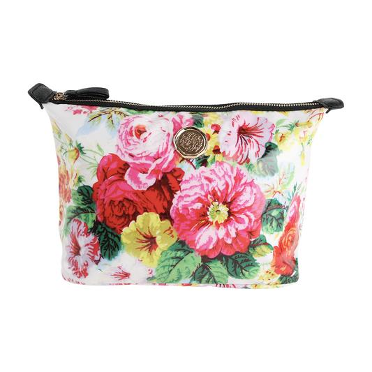 Annalise Large Cosmetic Bag—a rectangular zippered makeup bag with a colorful floral print of large pink, red, and yellow flowers, and a round gold emblem on the front—perfect as a travel organizer or spacious cosmetic bag.