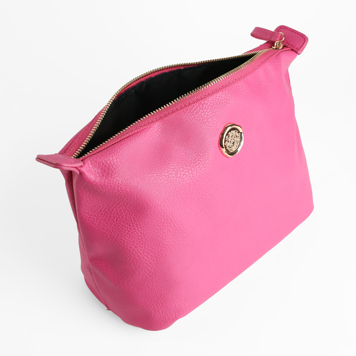 Introducing the Raspberry Pink Large Cosmetic Bag—a spacious makeup bag made from raspberry pink faux leather, featuring a zippered closure and adorned with a gold circular emblem. Displayed against a white background, it serves as a stylish travel toiletry bag.