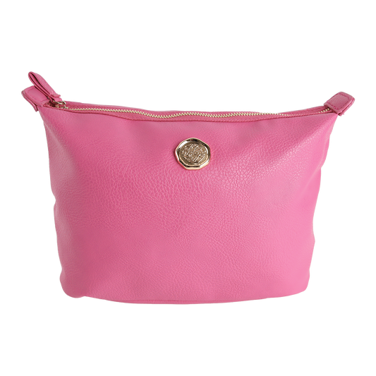 The Raspberry Pink Large Cosmetic Bag features a vibrant faux leather finish with a gold-tone circular emblem and zipper closure, shown against a plain white background. Spacious and stylish, it seamlessly doubles as either a large makeup bag or travel toiletry bag for everyday practicality.