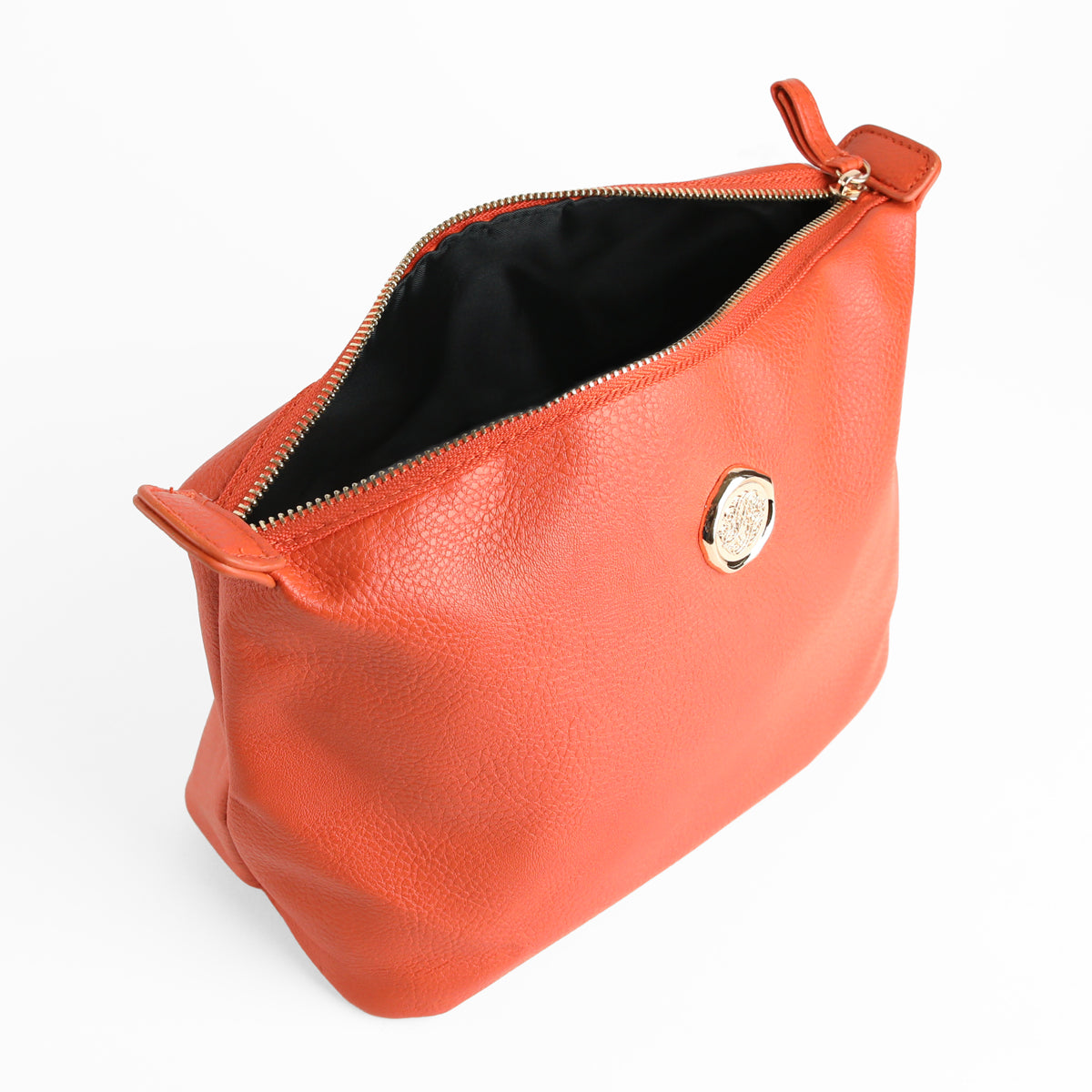 The Tangerine Orange Large Cosmetic Bag features a spacious design in tangerine orange faux leather, accented with a gold zipper and a round gold emblem, and has a black interior lining.