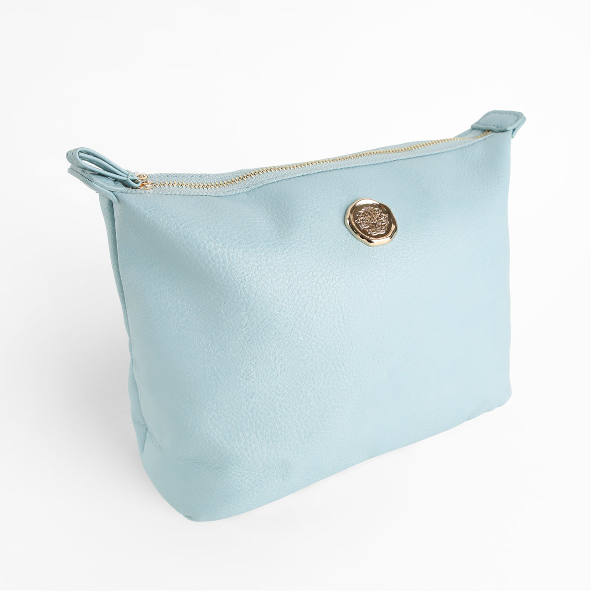 A Beach Glass Blue Large Cosmetic Bag made from faux leather, featuring a gold zipper and a round gold emblem on the front, is photographed against a plain white background. Combining style with practicality, this spacious cosmetic pouch is perfect for travel.