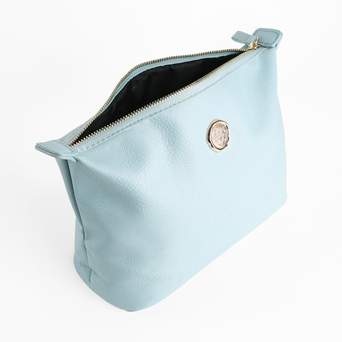 Beach Glass Blue Large Cosmetic Bag with a zippered closure and gold emblem, partially open to show its black interior. Featuring a pebbled texture and fabric pull tab on the zipper, this spacious travel makeup bag is perfect for carrying your essentials in style.