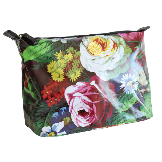A large colorful floral Astrid cosmetic bag with a prominent white rose design, a gold zipper, and a nylon interior.
