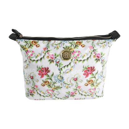 The Phoebe Large Cosmetic Bag, a chic floral-patterned zippered pouch featuring a gold emblem and black accents, is crafted from durable laminated cotton and shown on a white background—perfect for stylishly organizing your travel makeup essentials.