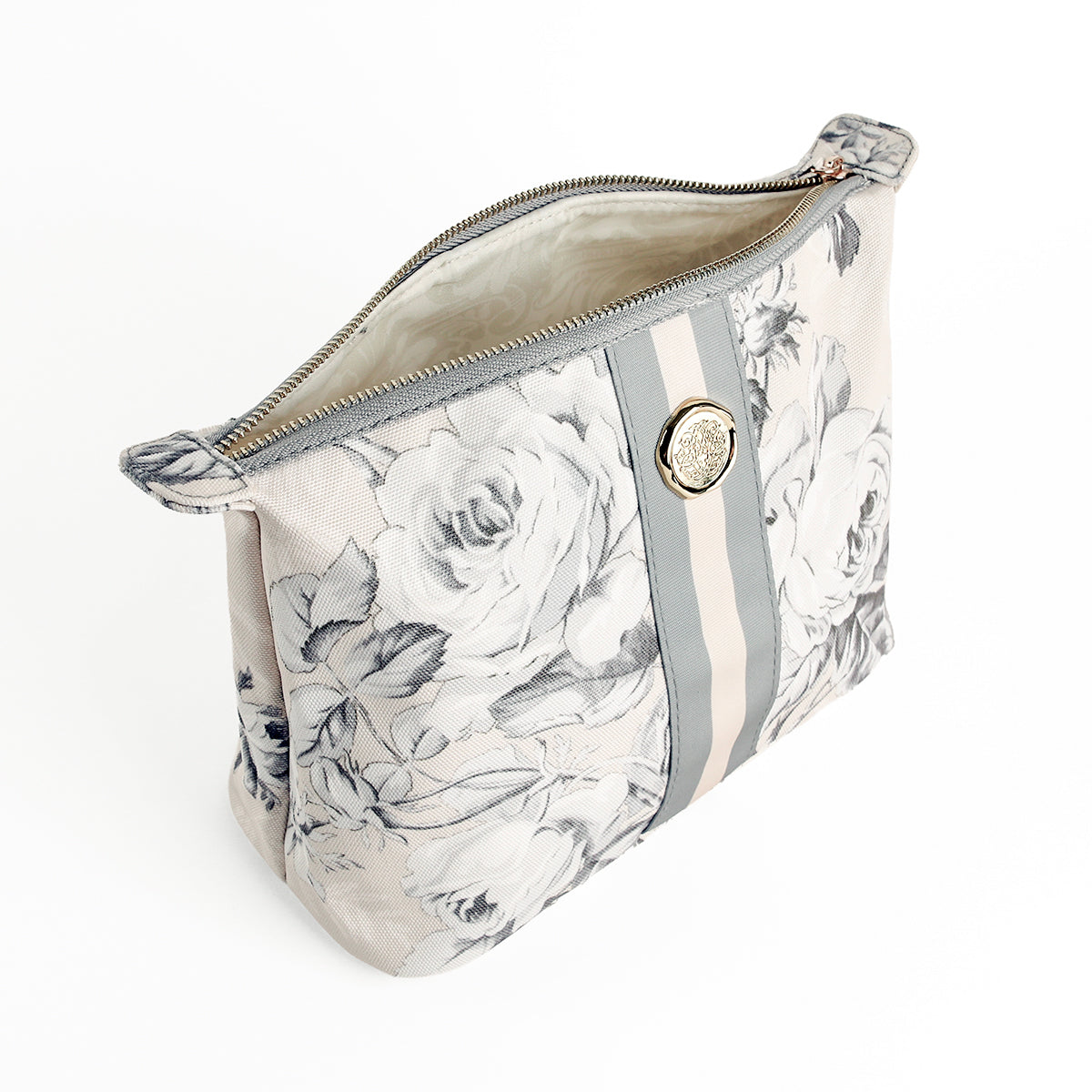 The Faded Rose Large Cosmetic Bag, featuring a beige exterior with gray floral patterns, vertical stripes, and a decorative round button, is shown photographed on a white background.
