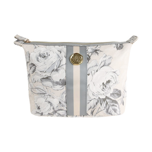 The Faded Rose Large Cosmetic Bag is a zippered makeup bag featuring a gray floral pattern, vertical light gray stripes, and a round gold emblem on the front.