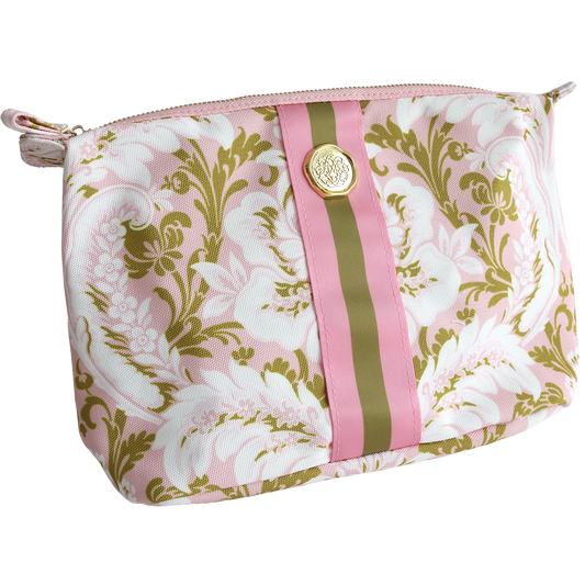 The Pink Damask Large Cosmetic bag features a pink and olive floral pattern, durable cotton construction, a central olive and pink ribbon detail, and a gold medallion accent, displayed against a white background.