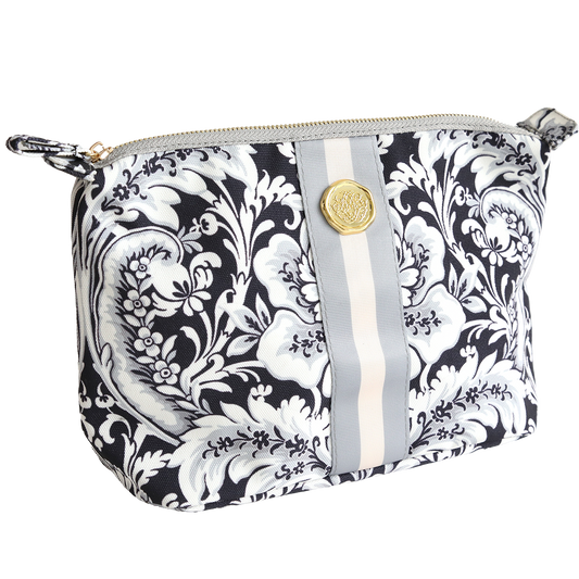 The Damask Noire Large Cosmetic is a black and white floral zippered pouch with a central gray and cream stripe, crafted from durable cotton with a gold emblem—ideal as a spacious cosmetic or travel toiletry bag.