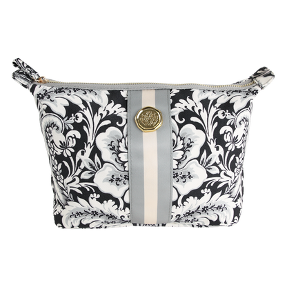 Introducing the Damask Noire Large Cosmetic Bag, featuring a black and white floral damask print with a sophisticated gray and beige vertical stripe and an eye-catching round gold emblem on the front. This elegant travel cosmetic bag is perfect for keeping your essentials organized in style.