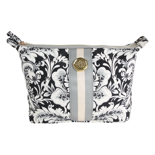 Introducing the Damask Noire Large Cosmetic Bag, featuring a black and white floral damask print with a sophisticated gray and beige vertical stripe and an eye-catching round gold emblem on the front. This elegant travel cosmetic bag is perfect for keeping your essentials organized in style.