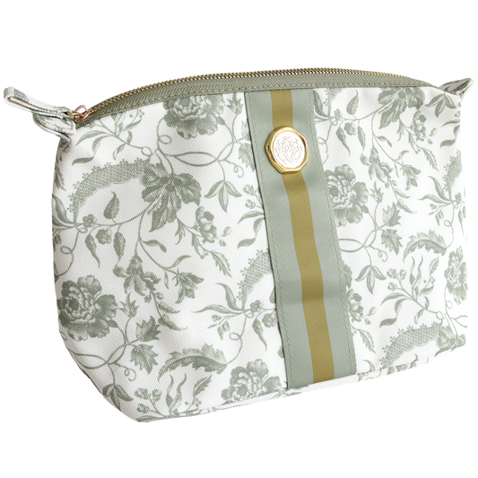 The Green Climbing Rose Large Cosmetic is a durable cotton bag with a green floral pattern, zipper closure, and a green and gold stripe with a round emblem—ideal for organizing travel essentials.