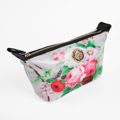 Lillian Small Cosmetic Bag featuring a floral pattern, gold zipper, and decorative round emblem, displayed on a white background.