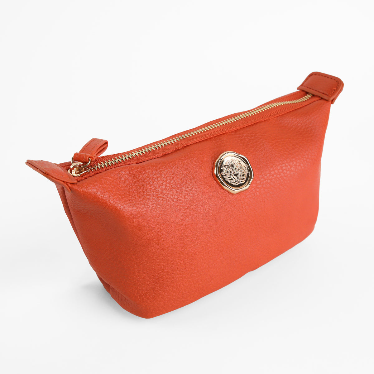 Tangerine Orange Small Cosmetic Bag with a gold emblem and textured faux leather finish, photographed on a white background. This compact makeup pouch features a secure zippered closure, making it perfect for carrying your mini travel essentials.
