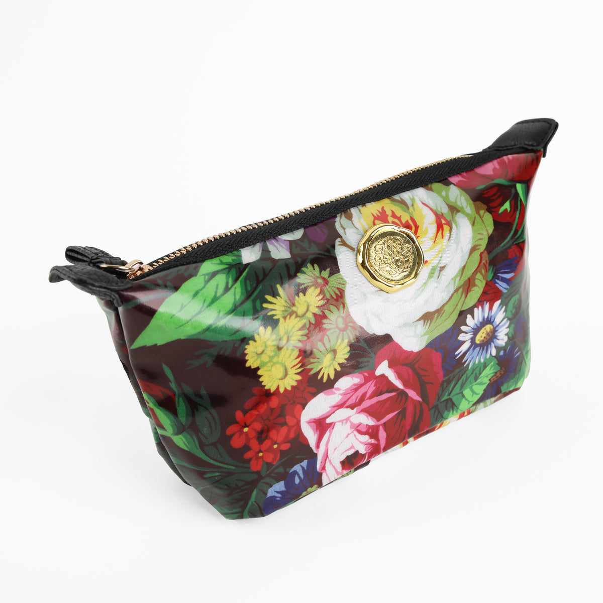 The Astrid Small Cosmetic Bag, featuring a beautiful botanical print and a gold emblem on the front, is shown photographed against a white background.