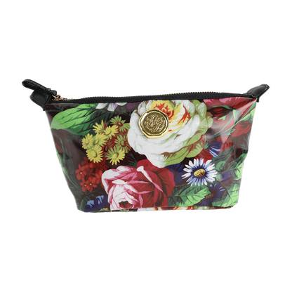 The Astrid Small Cosmetic Bag features a zippered closure, a vibrant botanical floral print, and a gold medallion accent on the front, shown against a white background.